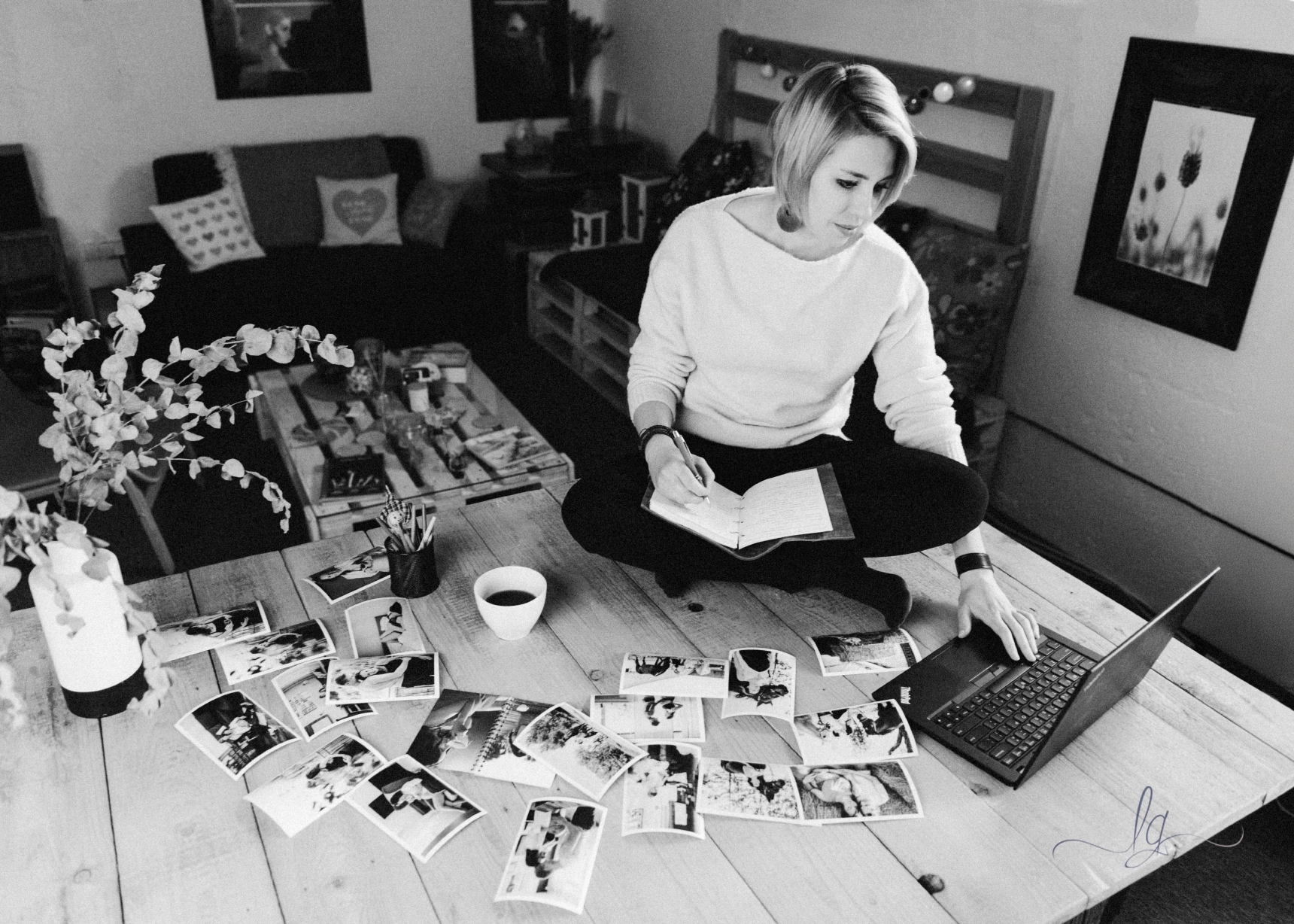 Lucy on table with printed photos