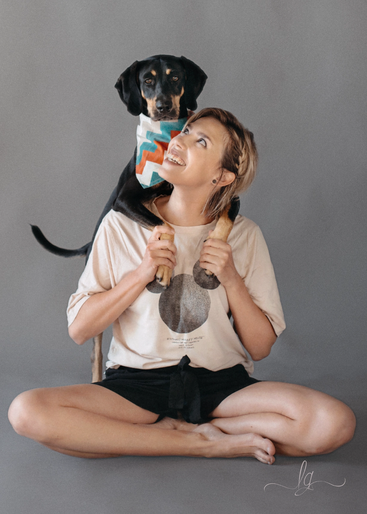 Lucy with dog on shoulder studio